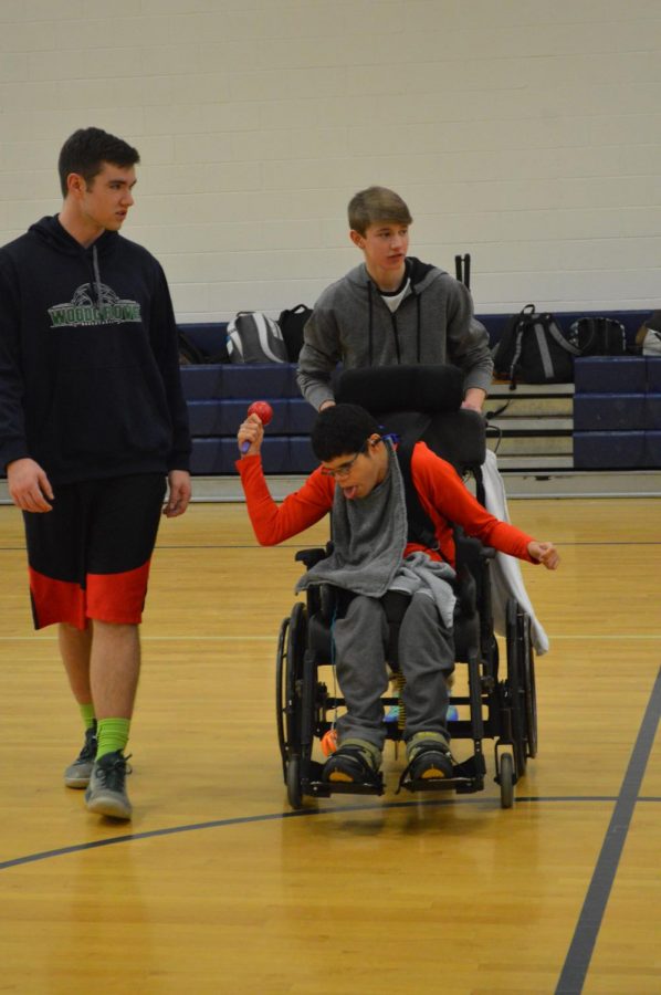 Partners Club member Grant is dances around with Juniors Billy Hughes and Nick Matyas.