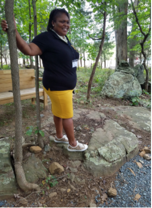 Pastor Michelle Thomas looks over historic African American gravesites in Loudoun County.