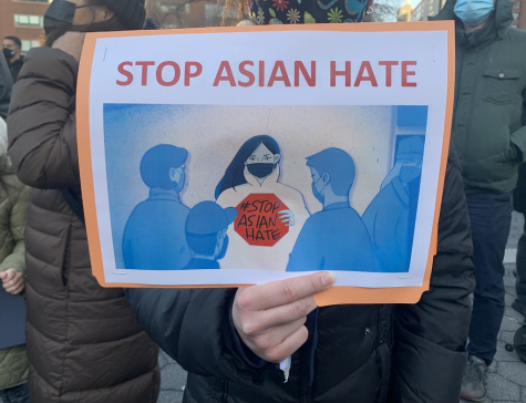 Protesters hold up an anti-Asian violence sign.
Creative Commons
