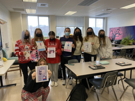 Mrs. Harar’s Women’s Studies class holding their posters for women’s standards in society. 