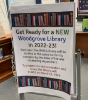A sign placed in the library informs visitors of the closure.