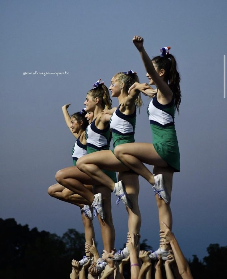 Woodgrove+cheerleaders+cheering+at+a+football+game.+Photo+taken+by+%40carolinejennsports.