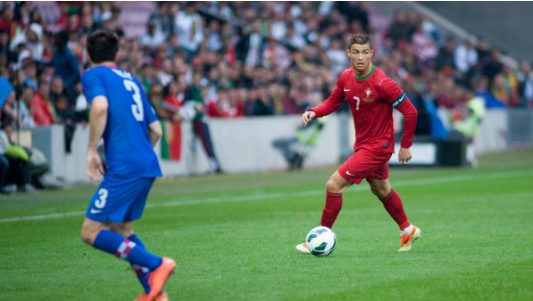 Cristiano Ronaldo dribbling the ball as a member of the Portugal National Team.