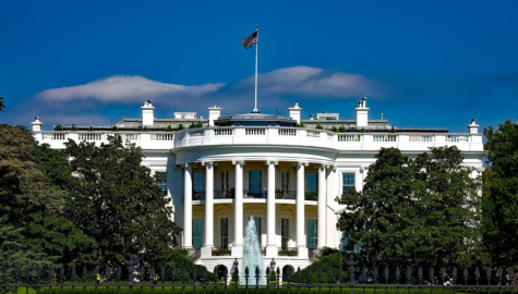The White House beneath looming clouds. Photo provided by Creative Commons.