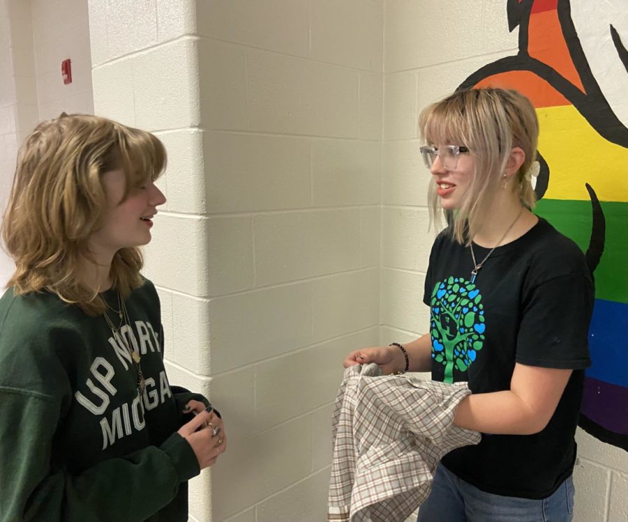 Costume mistress Rory Fricano (right) gives directions to costume crew member Madeline Rogers.