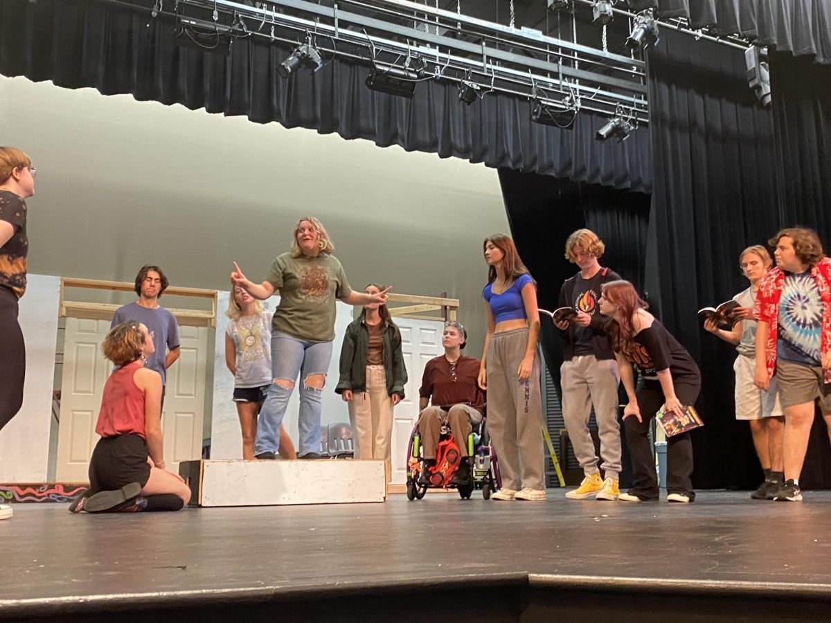 Students are gathered together on the stage for a Puffs rehearsal. Photo courtesy of Brooke Carmichael.
