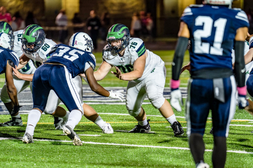 Rett Dean, pictured center, during a Woodgrove vs John Champe football game. Photo credits to Rett Dean.