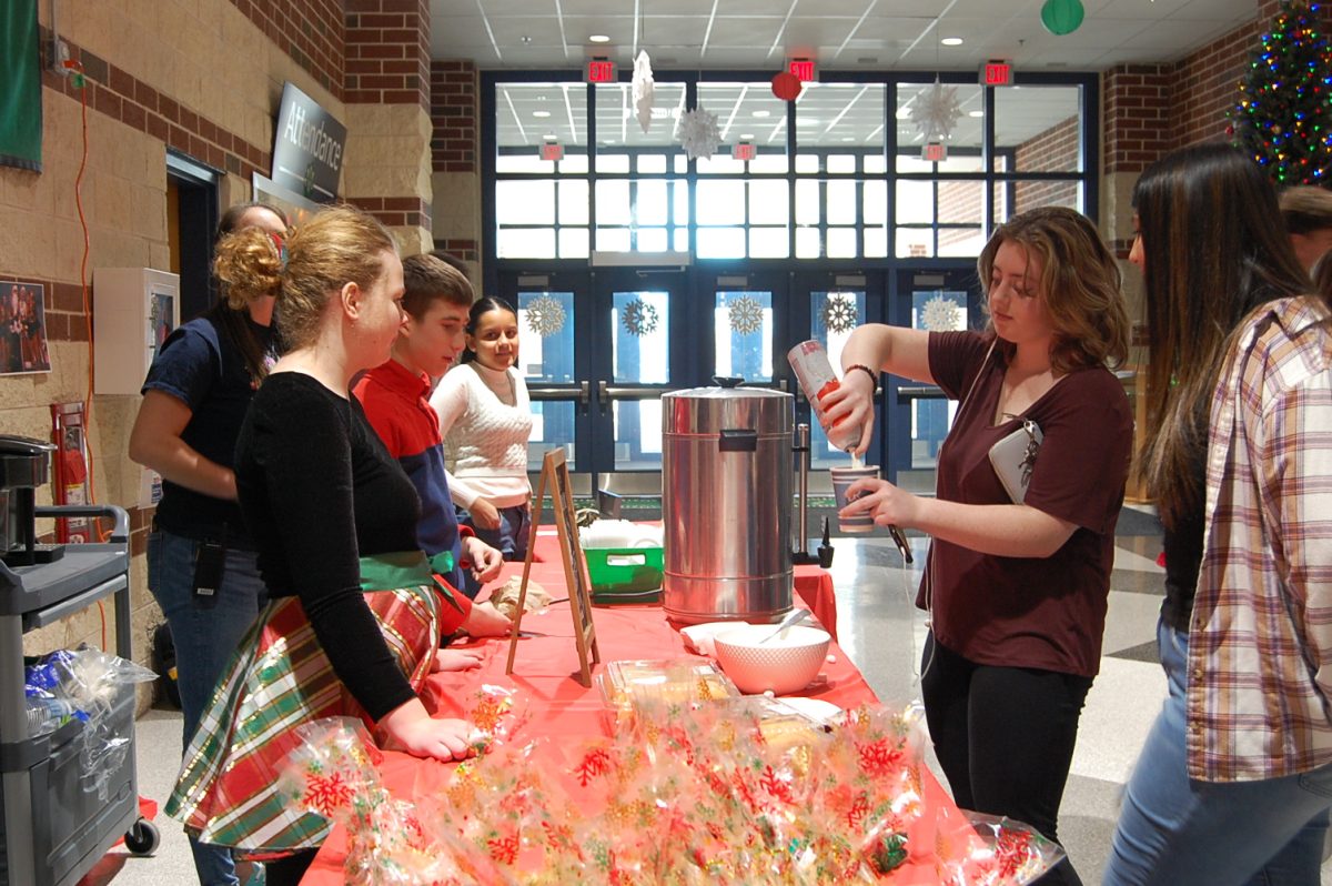 Students sell and purchase hot cocoa and sweet treats at the market’s coffee and hot cocoa bar. Photo provided by Mia Piatkowski. 