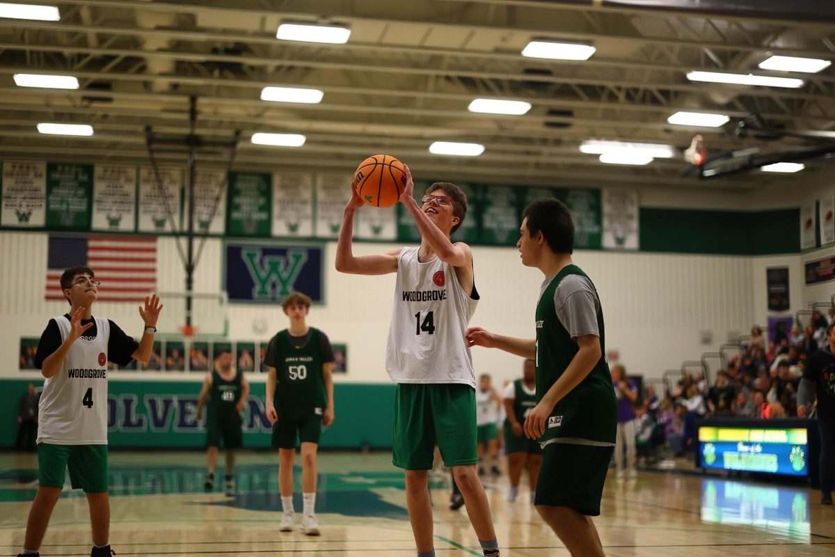 A Woodgrove player takes aim as he prepares to shoot a layup. Photo provided by Steve Prakope, Plaid Sheep Creative. 