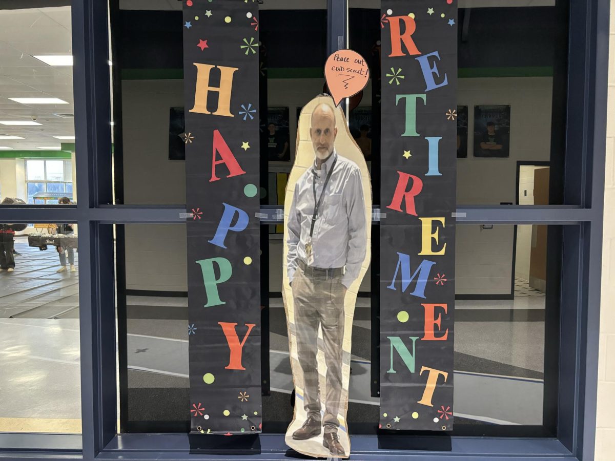 Picture of Mr. Panagos’ retirement sign outside of the cafeteria. Photo provided by Sam Douglas.