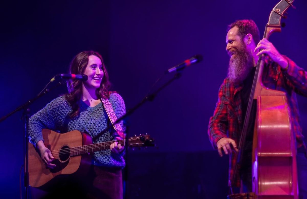 Lillian Hackett and Evan Bell exchange smiles during the performance at Tally Ho Theater. Photo captured by local photographer Jonah Welsh. 