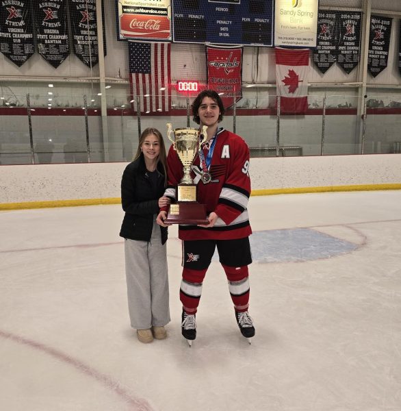 Luke Haraszkiewicz poses with a trophy after his team won the Chesapeake Bay Hockey League (CBHL) championship against a team ranked number seventh in the nation. Photo provided by Luke Haraszkiewicz. 