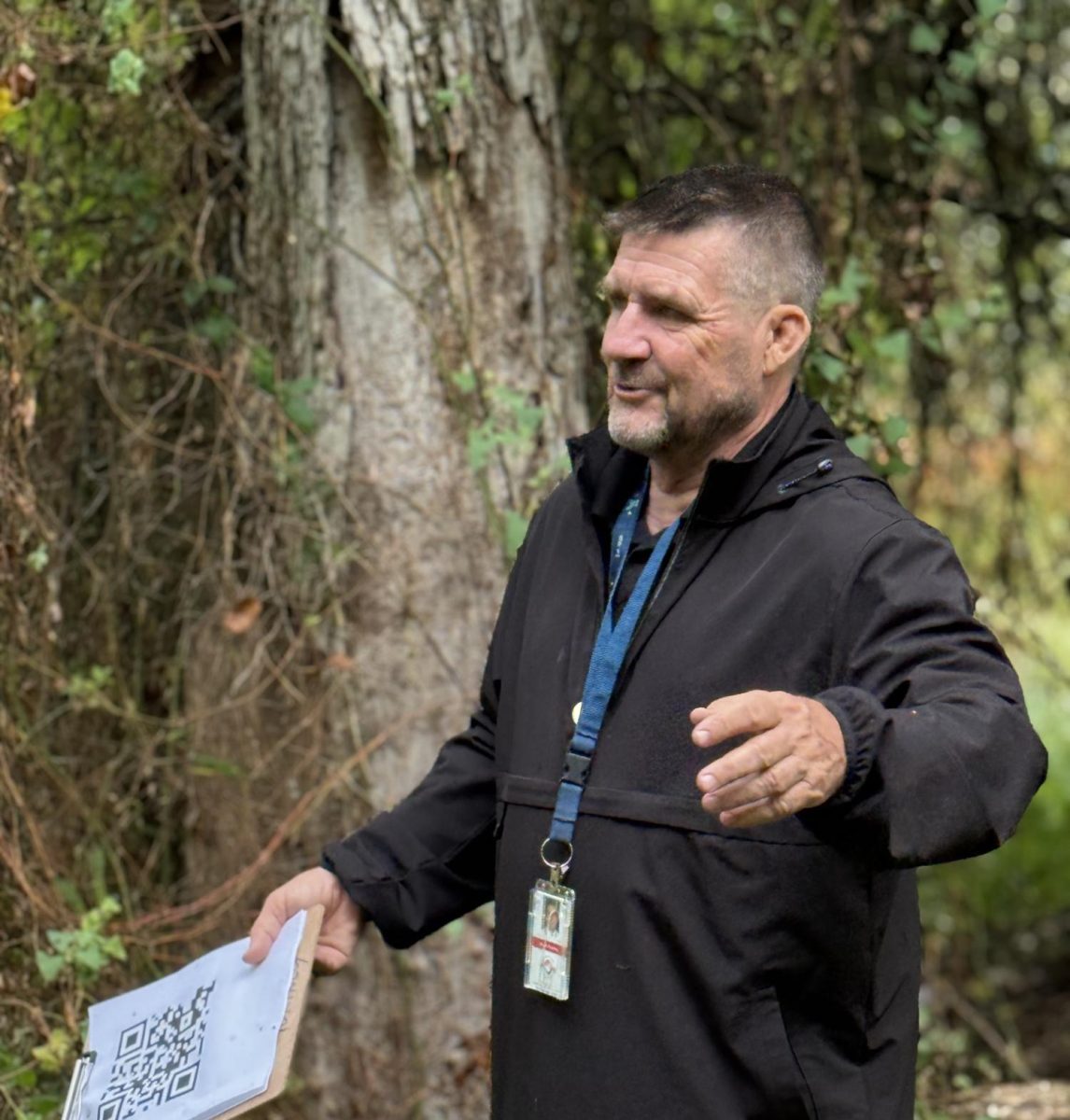 The Head Coordinator of the Woodgrove Environmental Academy, Mr. Scott Fortney, teaches his class on the nature trail at Woodgrove High School. Photo provided by Kathryn Gemmer.