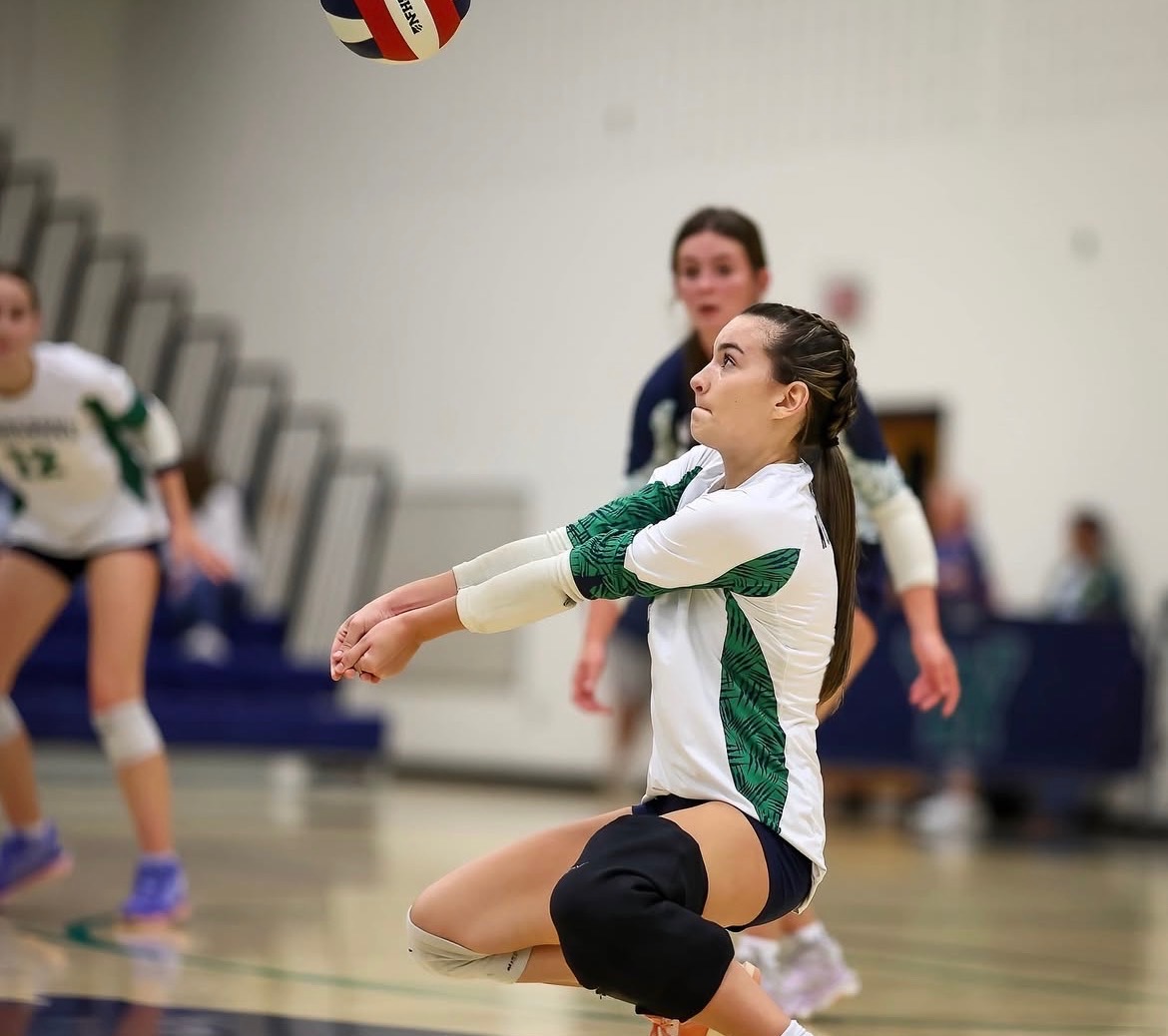 Bumping the ball, junior Ellie McCarthy gets the perfect pass to the setter. Photo provided by Ellie McCarthy.
