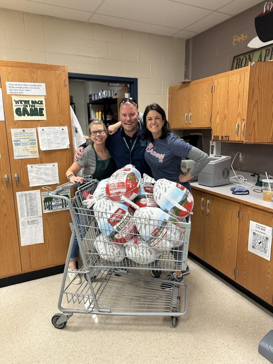 Woodgrove's Culinary and Gourmet Foods teaching team pose in front of 275 pounds of turkey that will be cooked for the annual Woodgrove staff Thanksgiving feast. Photo provided by Mr. Andrew Olejer.