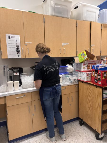 Pouring coffee into a cup, worker Casey Mills prepares an order for a customer. Photo provided by Vivien Wohlfeil.