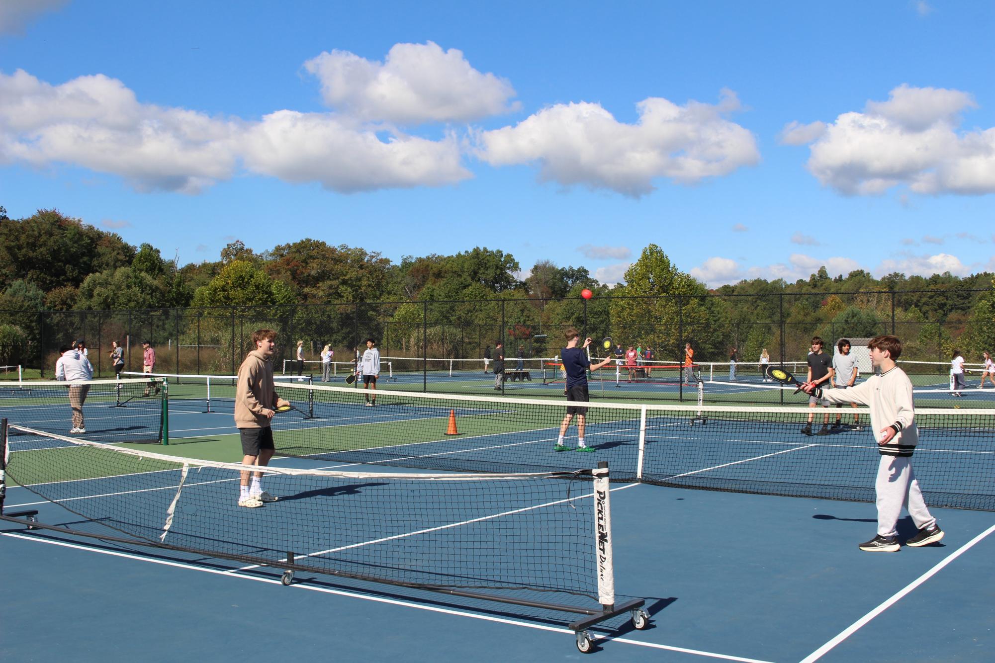 Pickleball Club members pass a ball back and forth. Photo provided by Woodgrove Journalism.