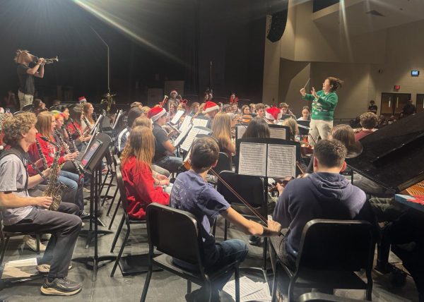 Ms. In Sim directs the orchestra at the Annual Holiday Concert. Photo provided by Mrs. Samantha Oakley.