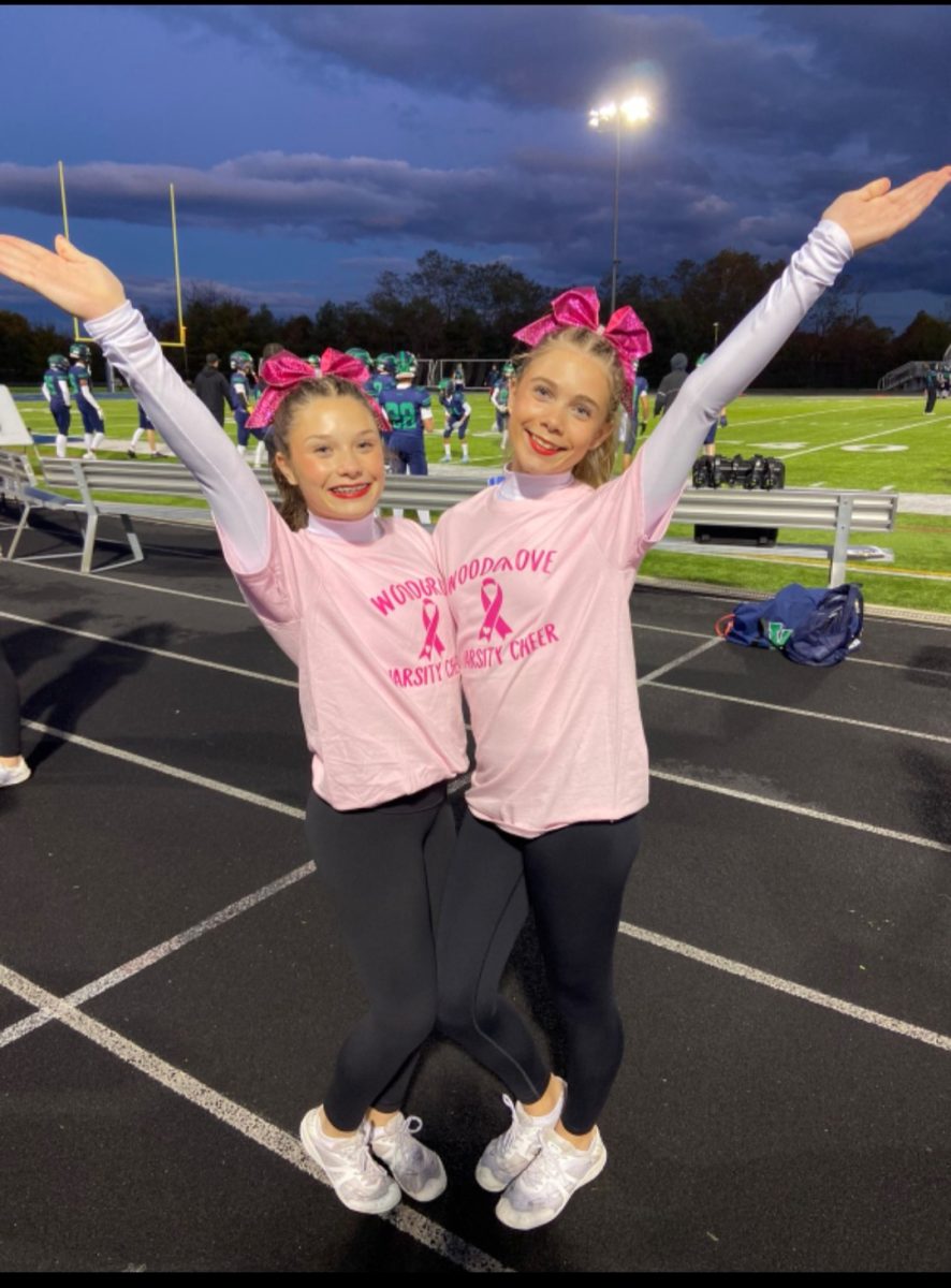 Anabel Persson stands on the sideline during a home game supporting breast cancer. Photo provided by Anabel Persson.
